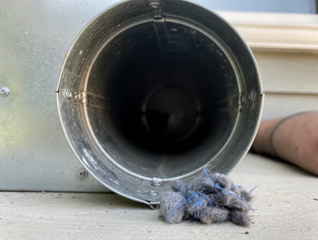 Lancaster Dryer Vent Cleaning technician using specialized equipment to clear severe dryer vent blockage in Lancaster